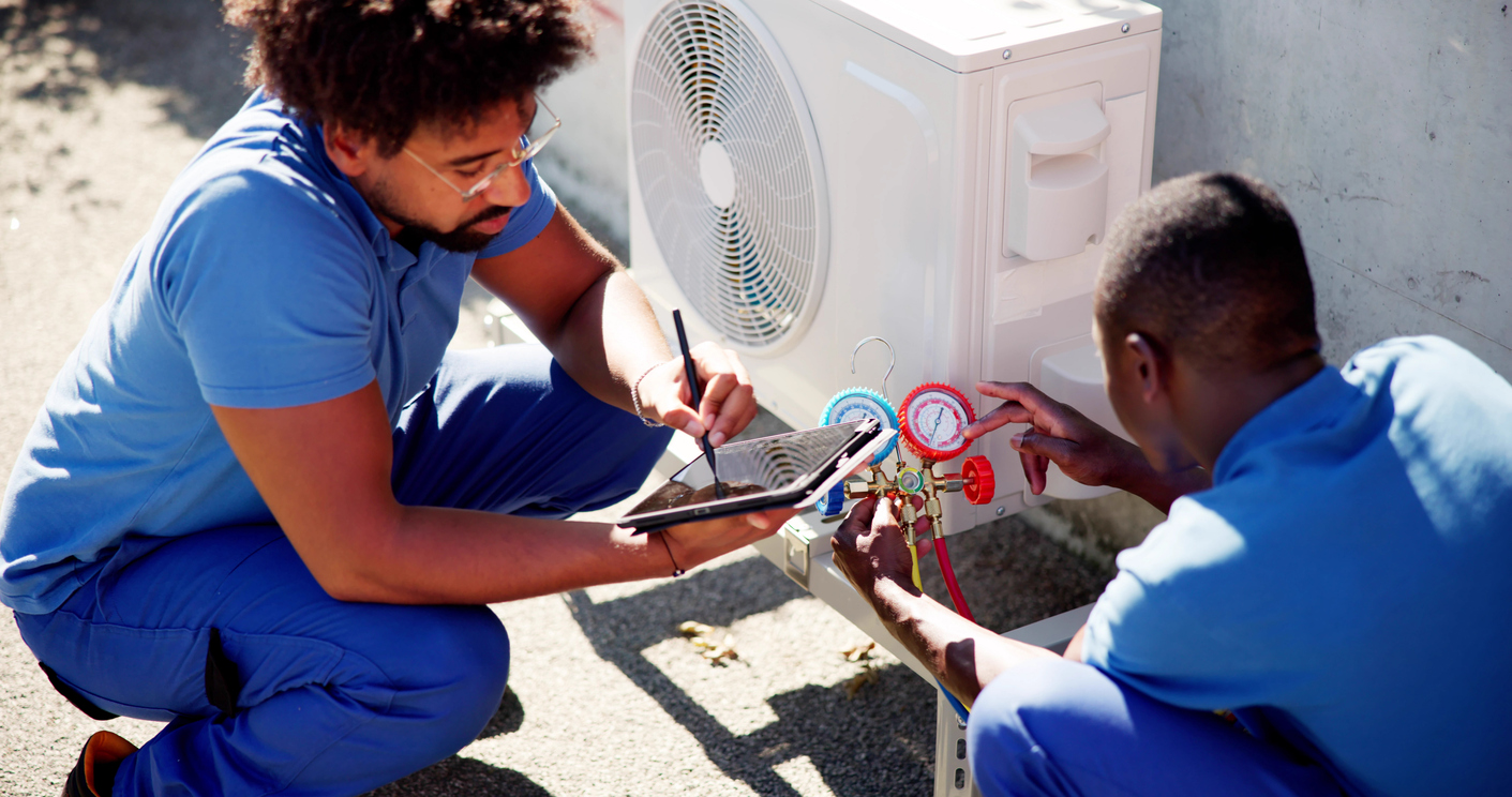 Technicians responding to a commercial refrigeration service call